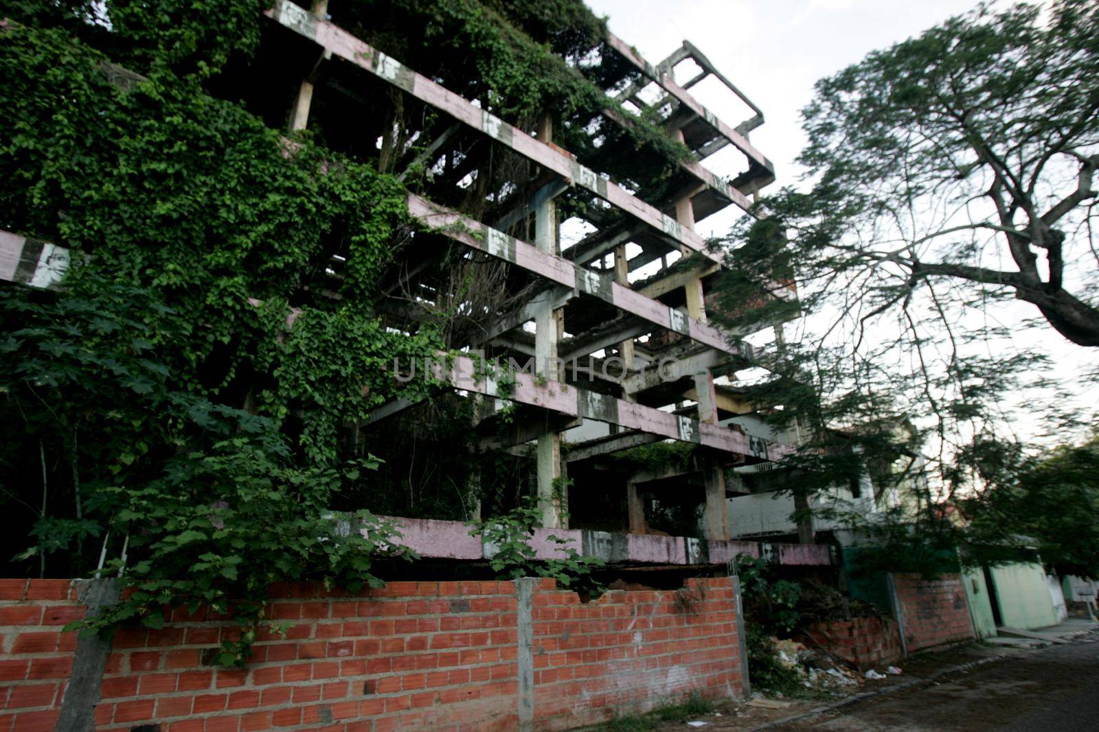 salvador, bahia / brazil - may 1, 2013: vegetation is seen in abandoned building construction in the neighborhood of Rio Vermelho in the city of Salvador.

