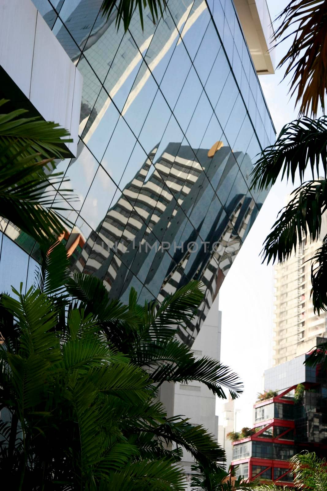 reflection in mirrored building by joasouza