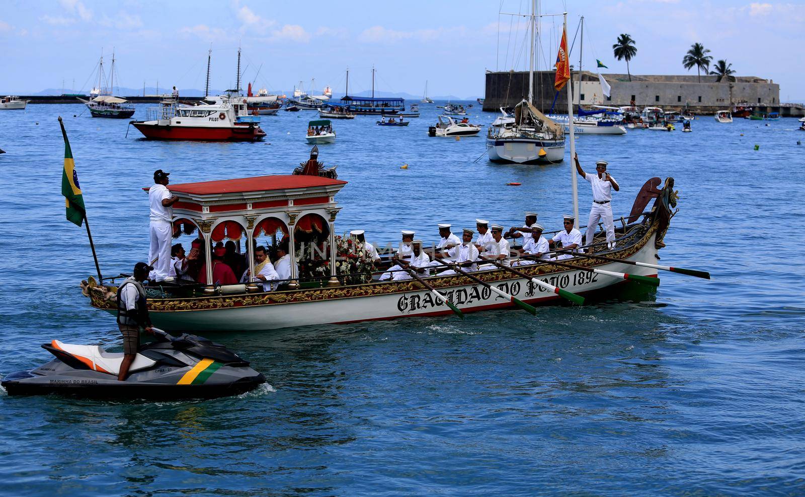 salvador, bahia / brazil - january 1, 2016: vessel Galeota Gratidao do Povo carries the image of Bom Jesus dos Navegantes during a maritime procession through the Todos os Santos Bay.