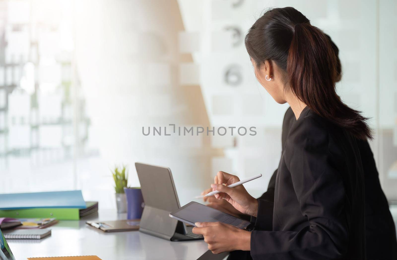 Group of Businessman and Accountant checking data document on digital tablet for investigation of corruption account . Anti Bribery concept by nateemee