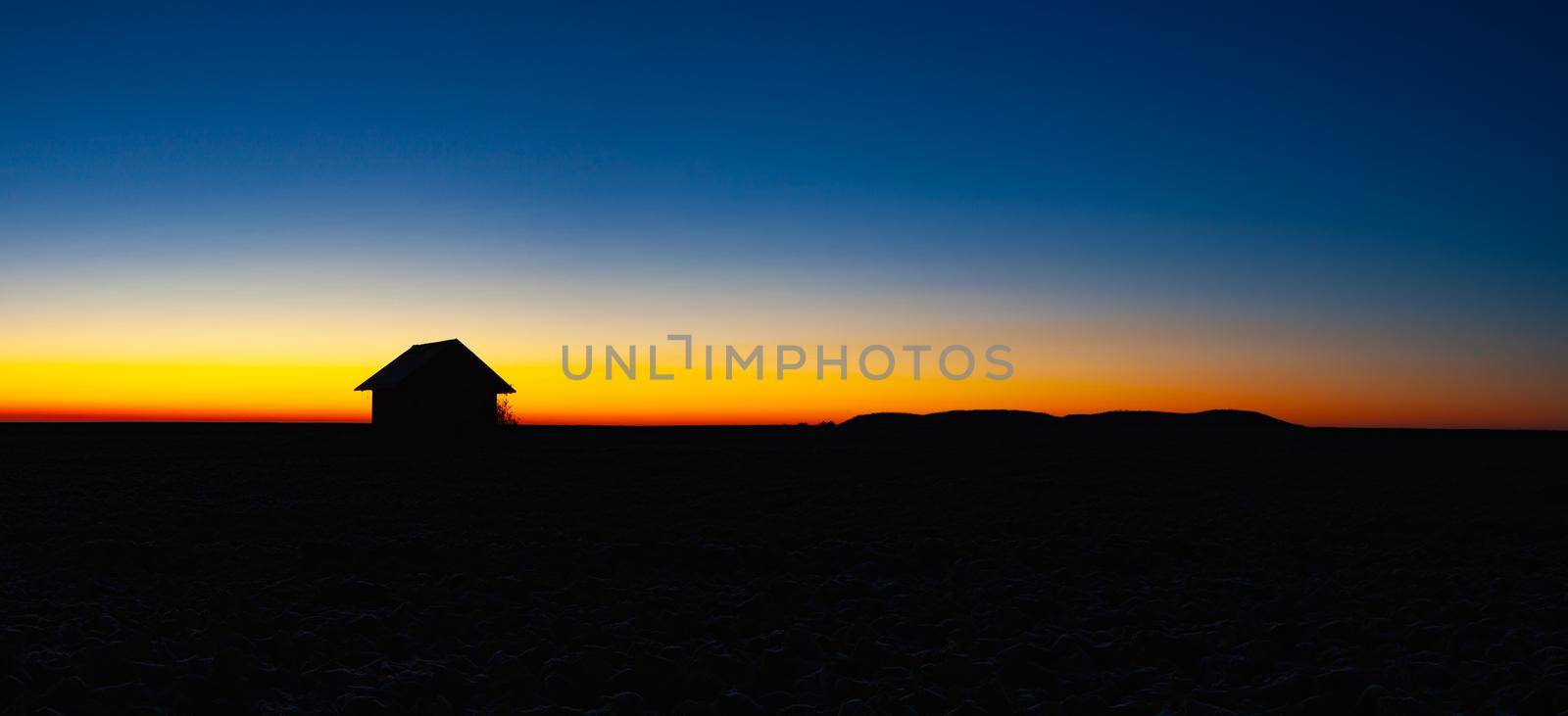 Old barn on the field at sunrise by CaptureLight