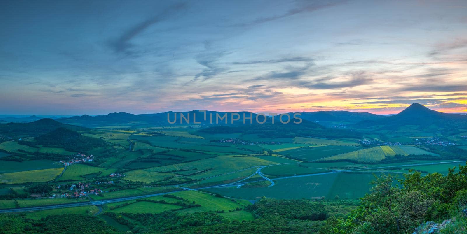 View from Lovos Hill. Sunset  in Central Bohemian Highlands, Czech Republic. Central Bohemian Uplands  is a mountain range located in northern Bohemia. The range is about 80 km long.