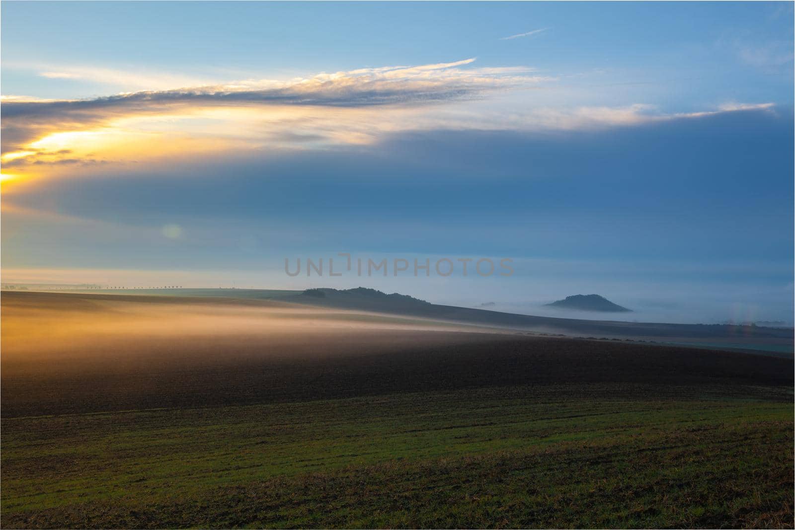 Landscape covered with fog in Central Bohemian Uplands, Czech Republic. Central Bohemian Uplands is a mountain range located in northern Bohemia. The range is about 80 km long