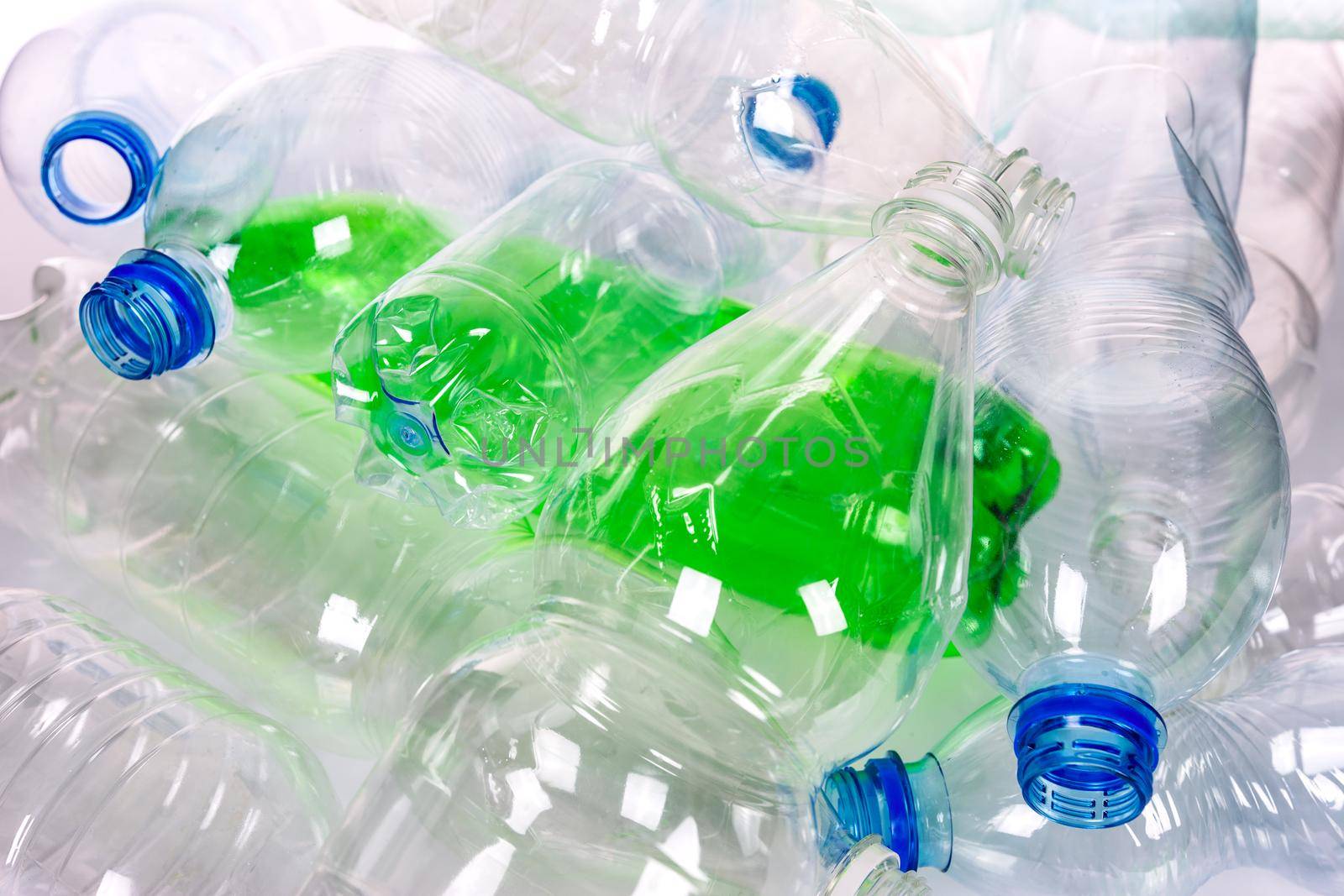 Environmental pollution concept - empty plastic bottles ready for recycling in close-up.
