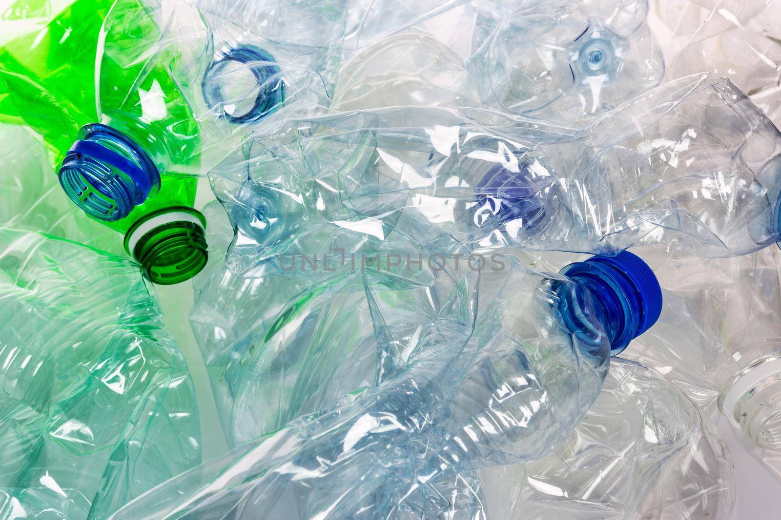 Empty colorful plastic bottles background by wdnet_studio