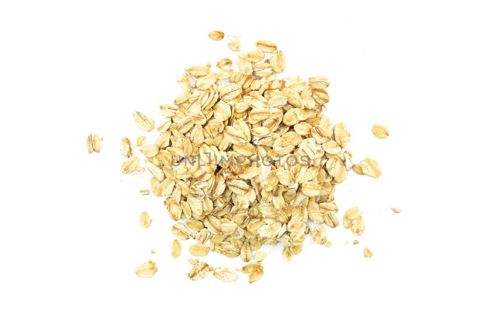 Top view of oatmeal flakes on a white background