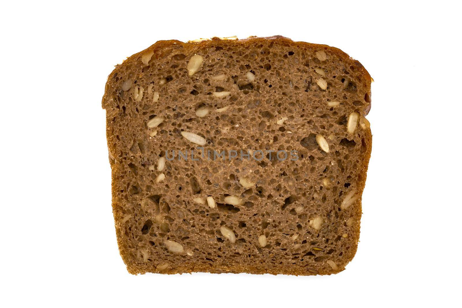 Slice of wholemeal dark bread isolated on a white background in close-up (high details)