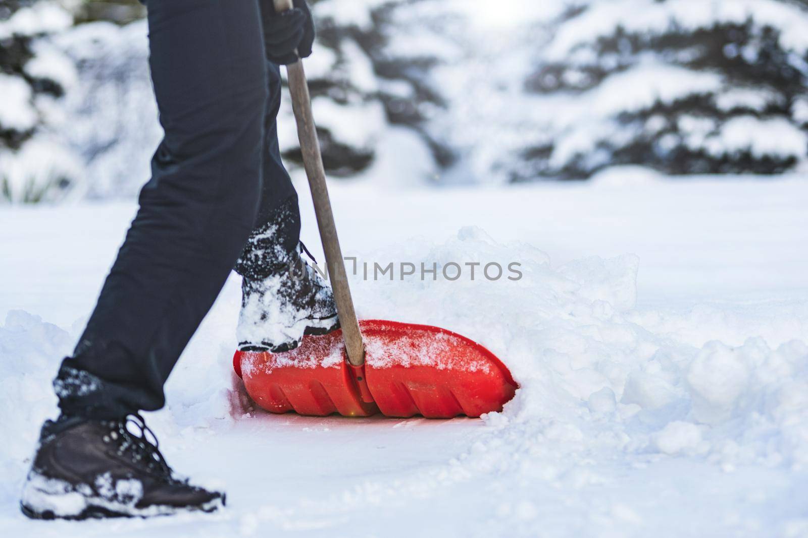 Man shoveling snow by wdnet_studio