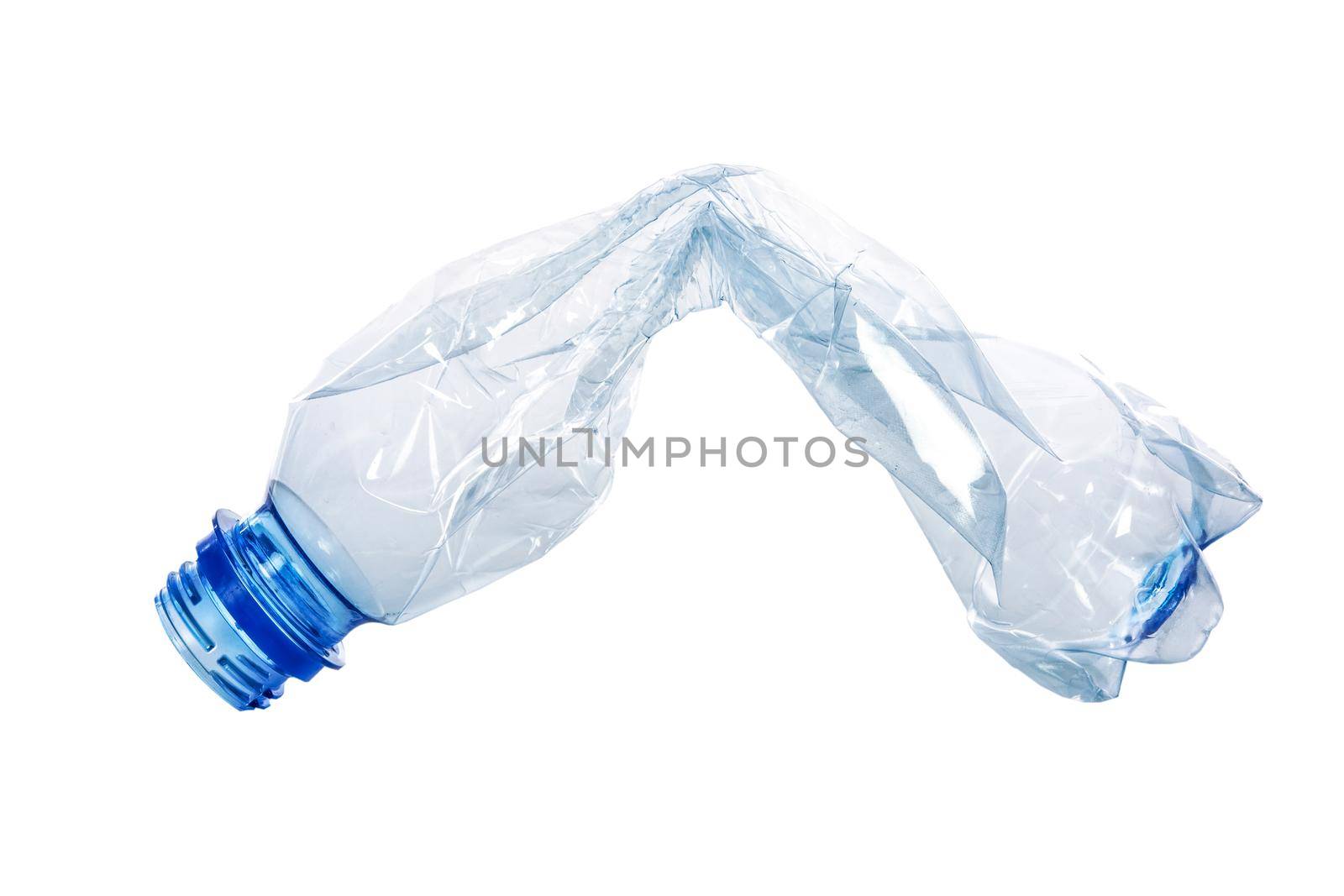 Single crumpled plastic blue bottle isolated on a white background in close-up