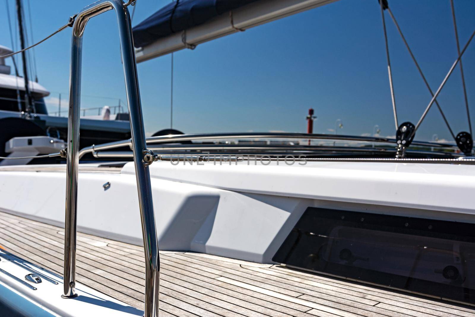 Sailing concept - deck and yacht hull in close-up