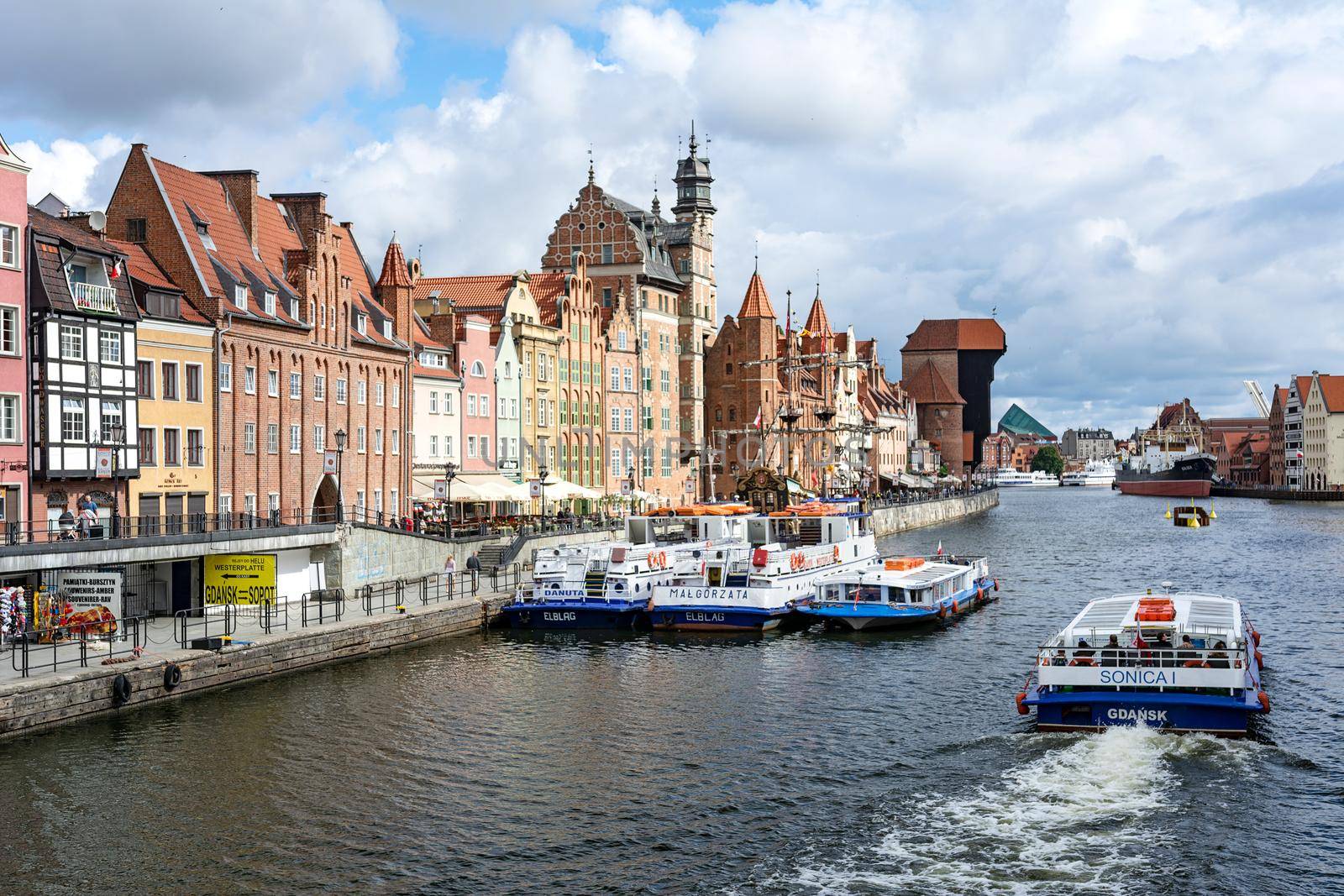 Gdansk, Poland - June 26, 2018: Tourist cruise ship on Motlawa river in historical Old Town of Gdansk City