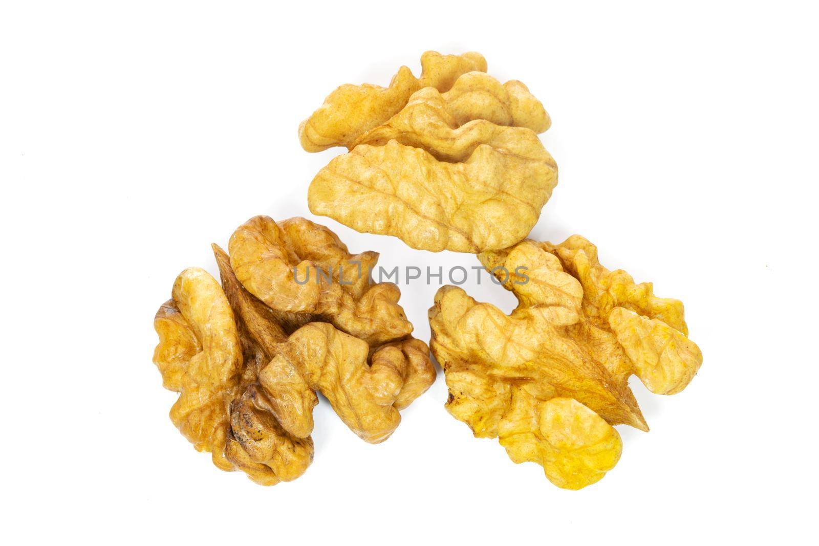 Top view of dry and shelled walnuts isolated on a white background