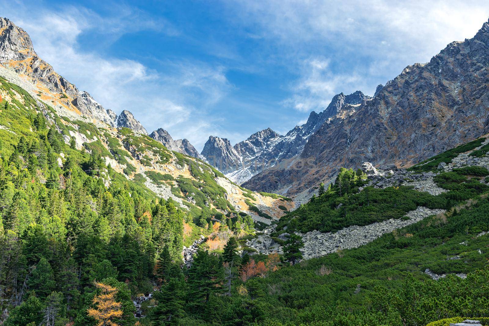 Majestic view of National Park High Tatras Mountains in Popradske Pleso, Slovakia on a sunny autumn day ( below Sedlo pod Ostrvou)