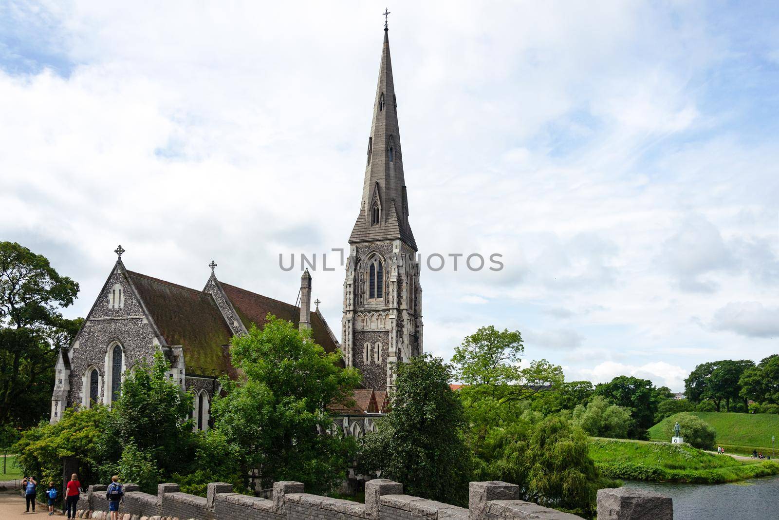 Copenhagen, Denmark - July 24, 2017: Tourists visiting famous St Albans Anglican Church in Copenhagen.  Church designed by Arthur Blomfield in Gothic Revival style and built in 1887.