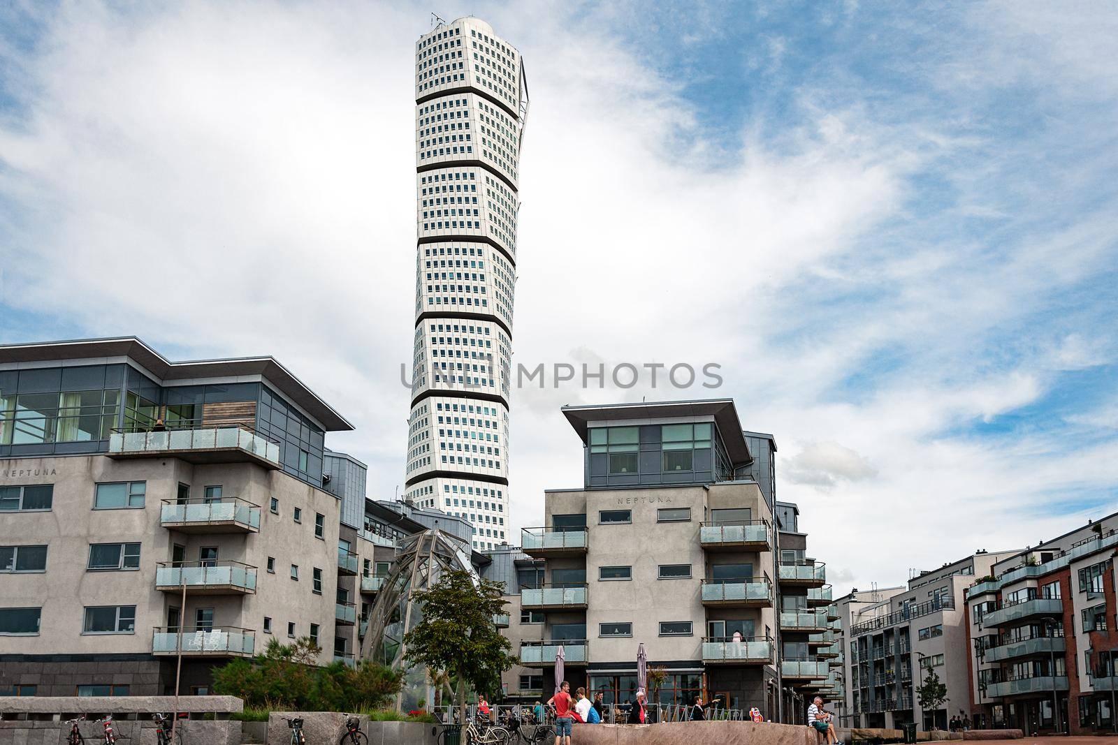 Malmo, Sweden - July 22, 2017: Luxury apartments in the Western Harbour in Malmo (Vastra Hamnen) on the background of the Turning Torso skyscraper.