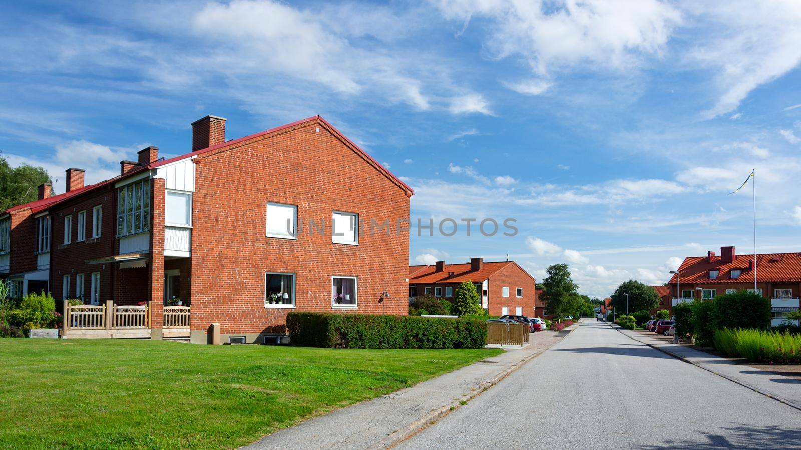 Veberod, Sweden - July 22, 2017:  Panoramic view of typical Swedish buildings multi-family houses in a small town and on the outskirts of the agglomeration.