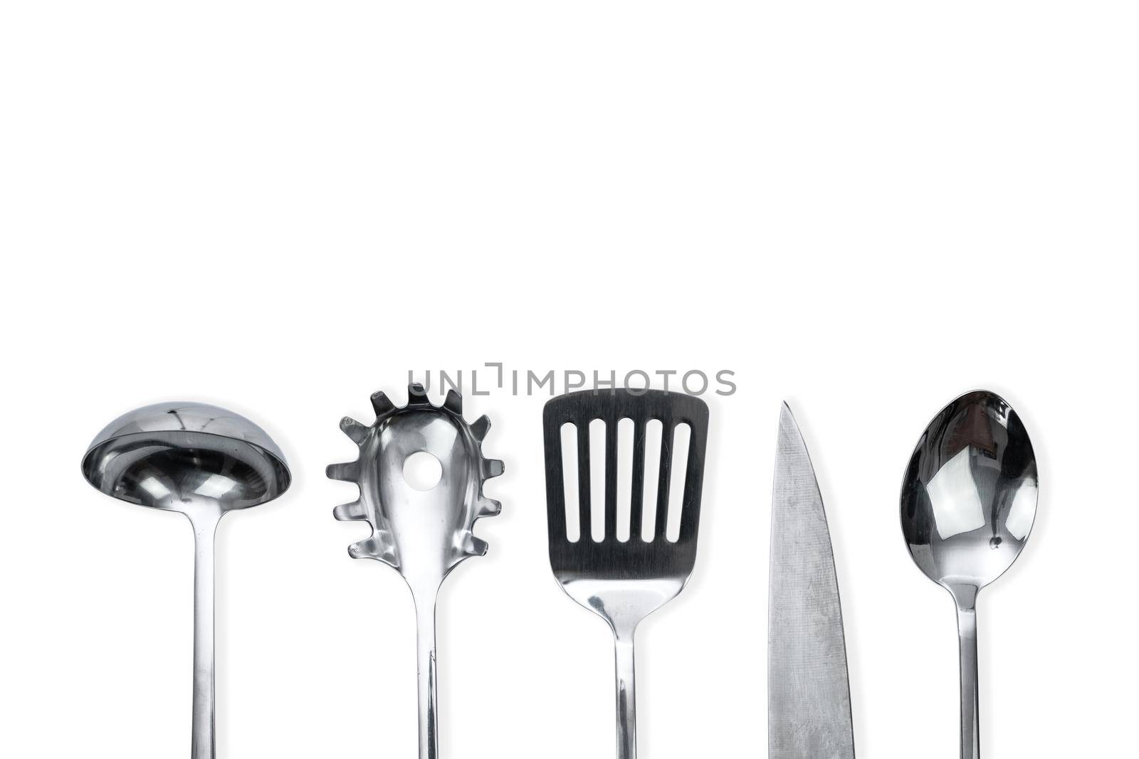 Top view of a silver kitchen utensil collection isolated on white background with copy space