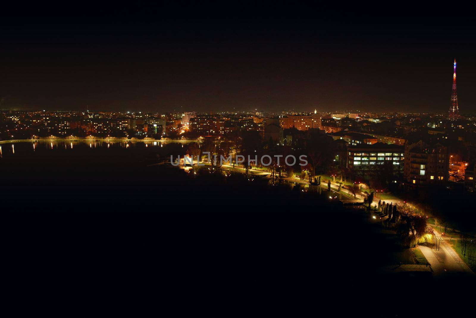 Panoramic night view of city with beautiful lights and incredible building. Concept of beautiful view building and lighted road at night.