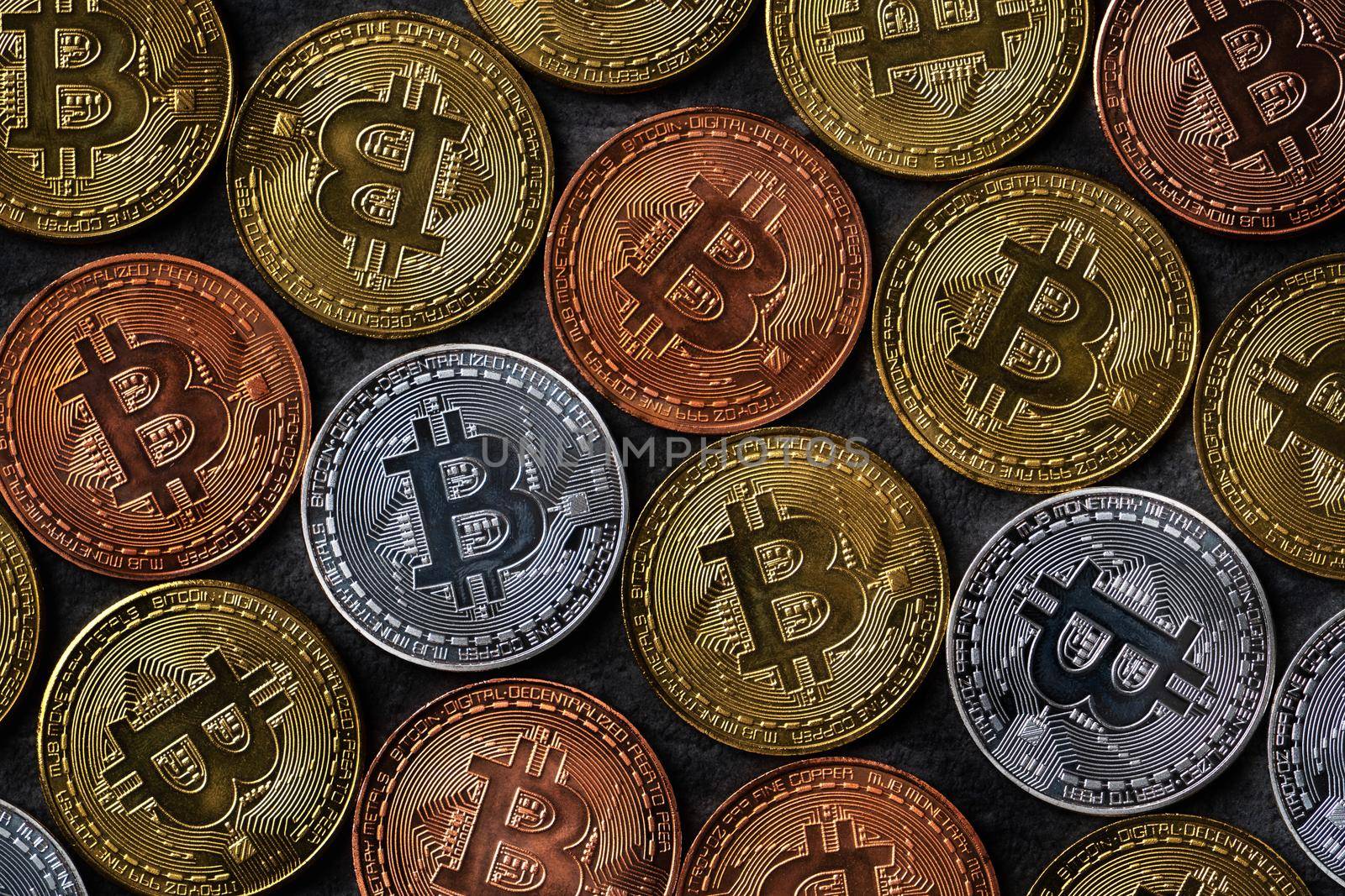 Top view business concept of bitcoin cryptocurrency money on dark black slate table background.