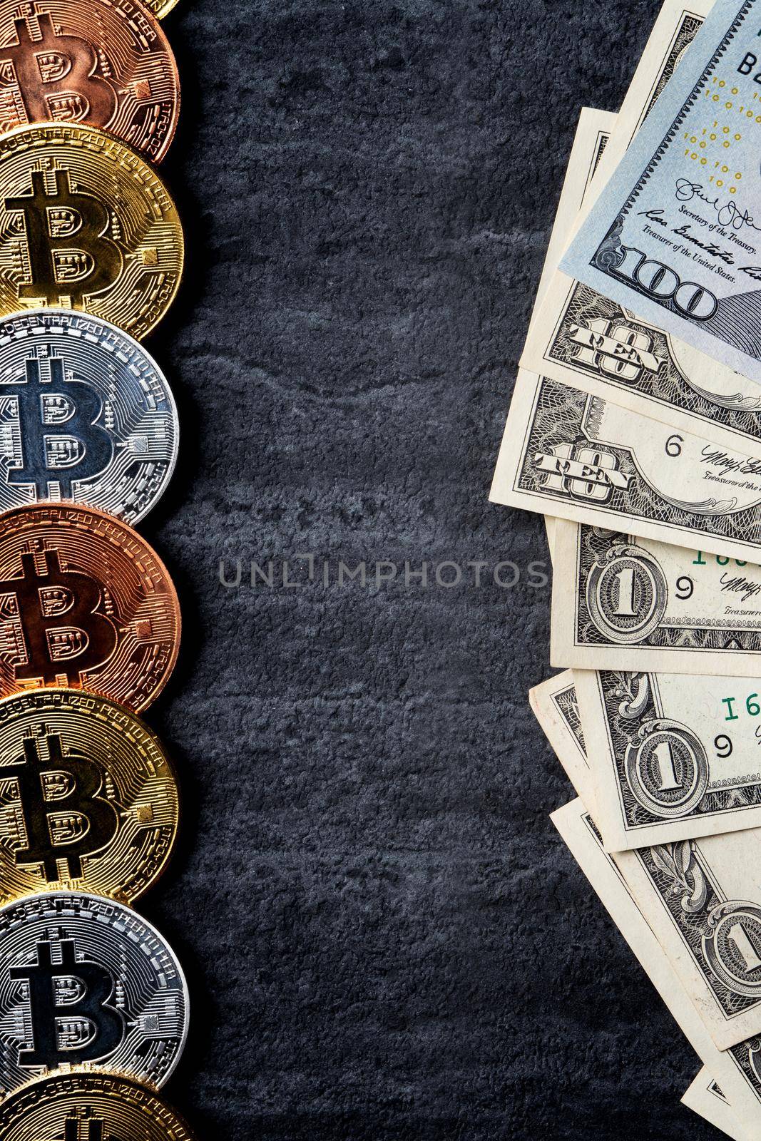 Business top view design concept of cryptocurrency bitcoin with USD Dollar paper currency money over dark black table background.