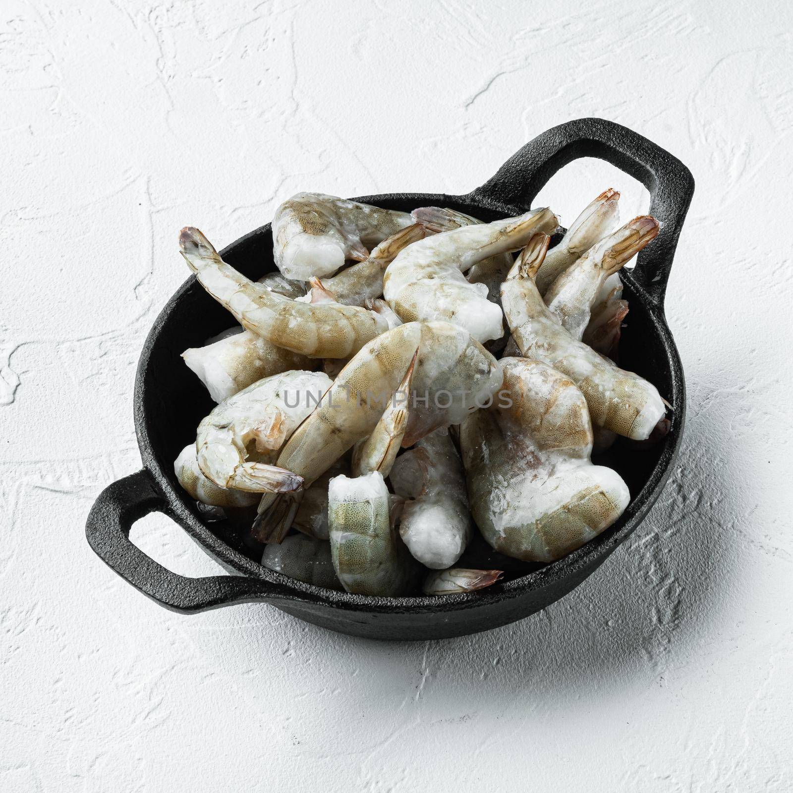 Frozen shell on Tiger Prawns or Asian tiger Shrimps, on white stone surface, square format by Ilianesolenyi