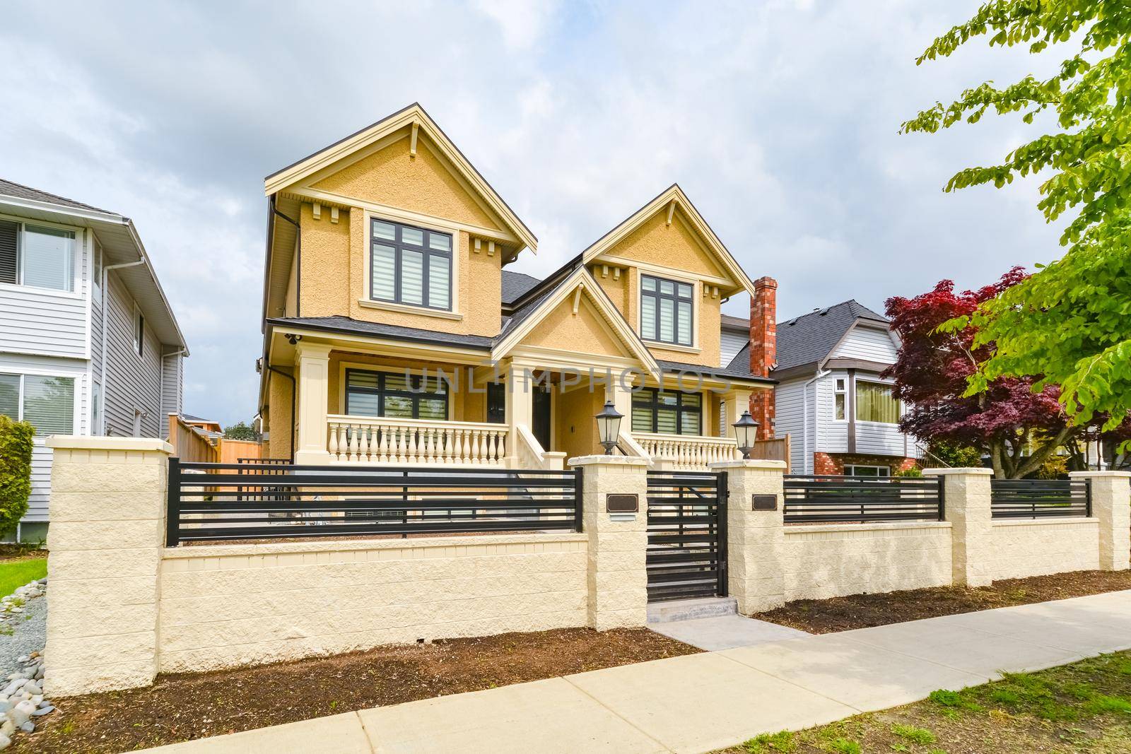 Newly renovated luxury residential house for sale. Big family house for with concrete pathway and metal  fence in front