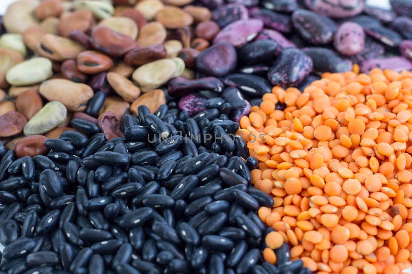 Multicolored background of healthy vegan vegetarian grain food cereal bean lentils ingredients mix
