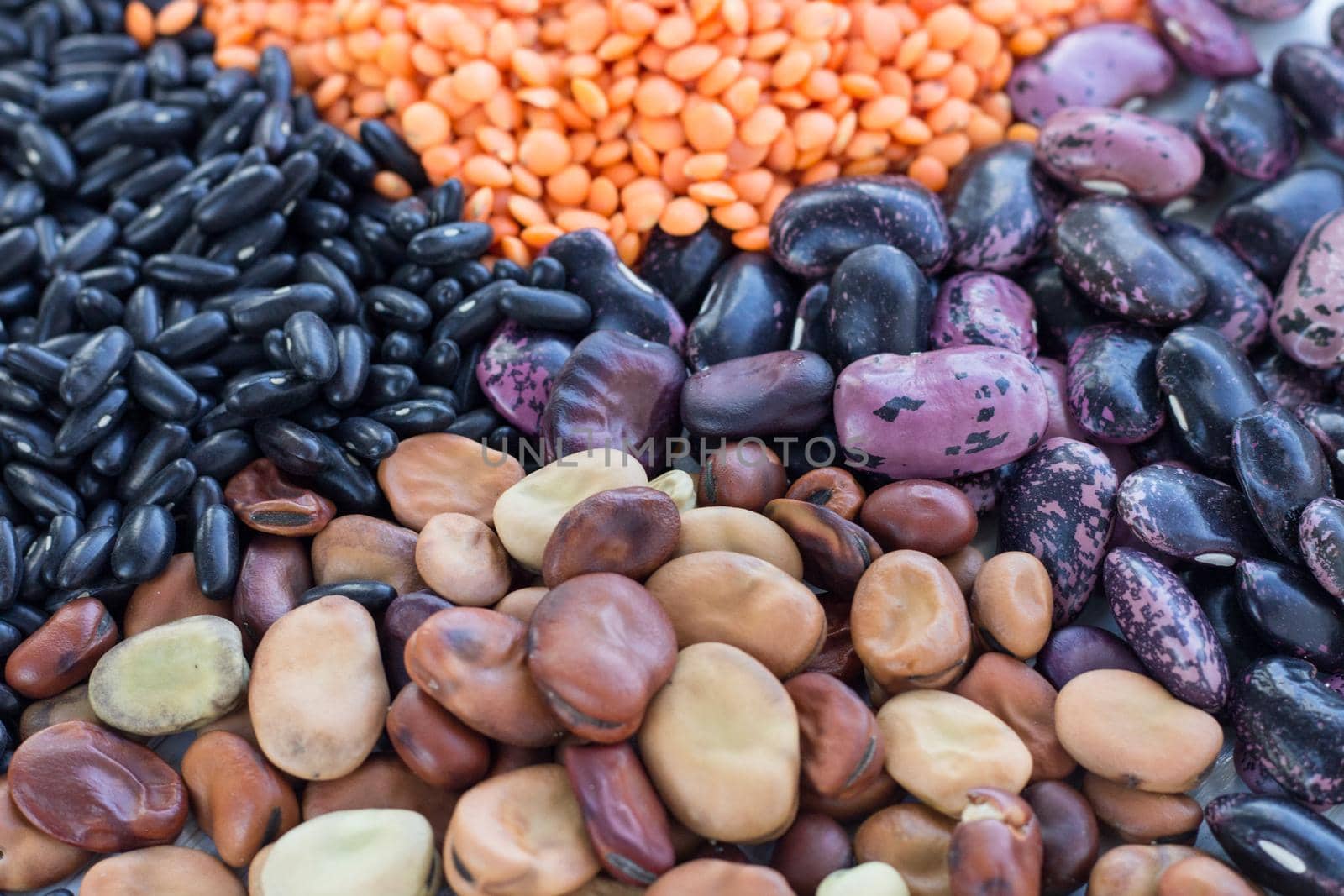 Multicolored background of healthy organic vegetarian grain food cereal bean lentils ingredients mix by VeraVerano