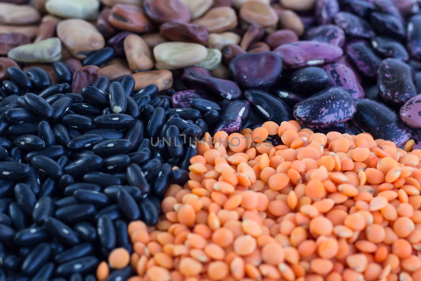 Multicolored background of healthy organic vegan vegetarian food cereal bean lentils ingredients mix