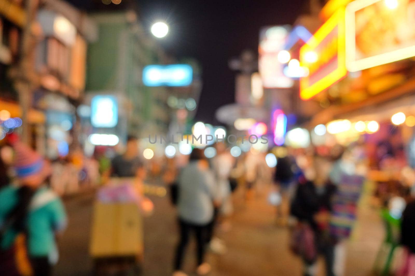 Blurred view on night scene of people and tourists on Khao San Road, Khao San Road is one of Bangkok's famous nightlife attractions, on blurred background