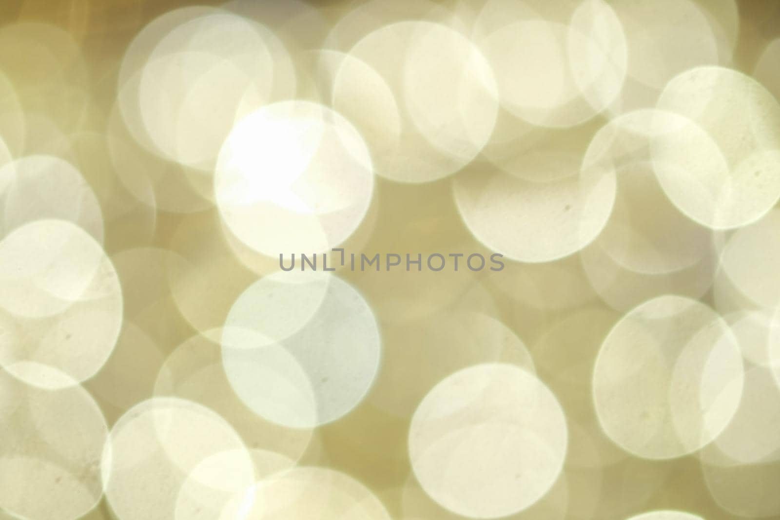 Abstract blurred gold color of LED lights bulb at night on Christmas and Happy New Year Event, bokeh blurred background