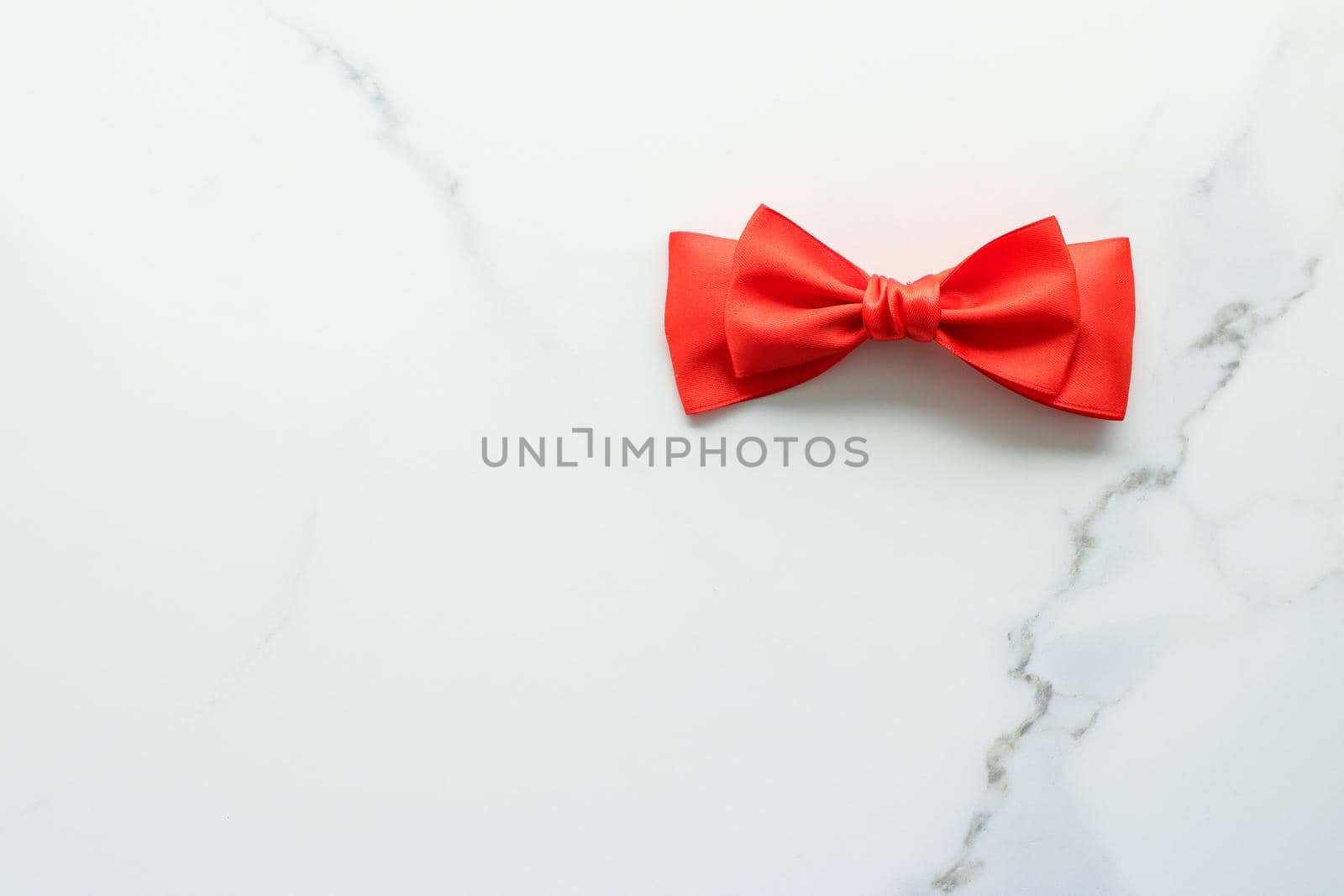 Holiday decor, feminine design and flatlay concept - Red silk ribbon on marble, top view