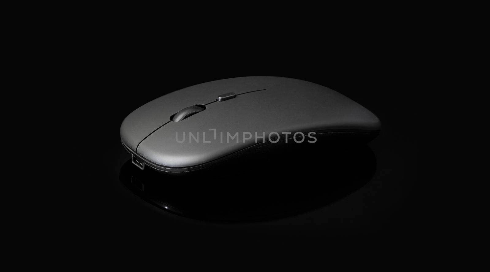 wireless black mouse isolated on black background by SlayCer