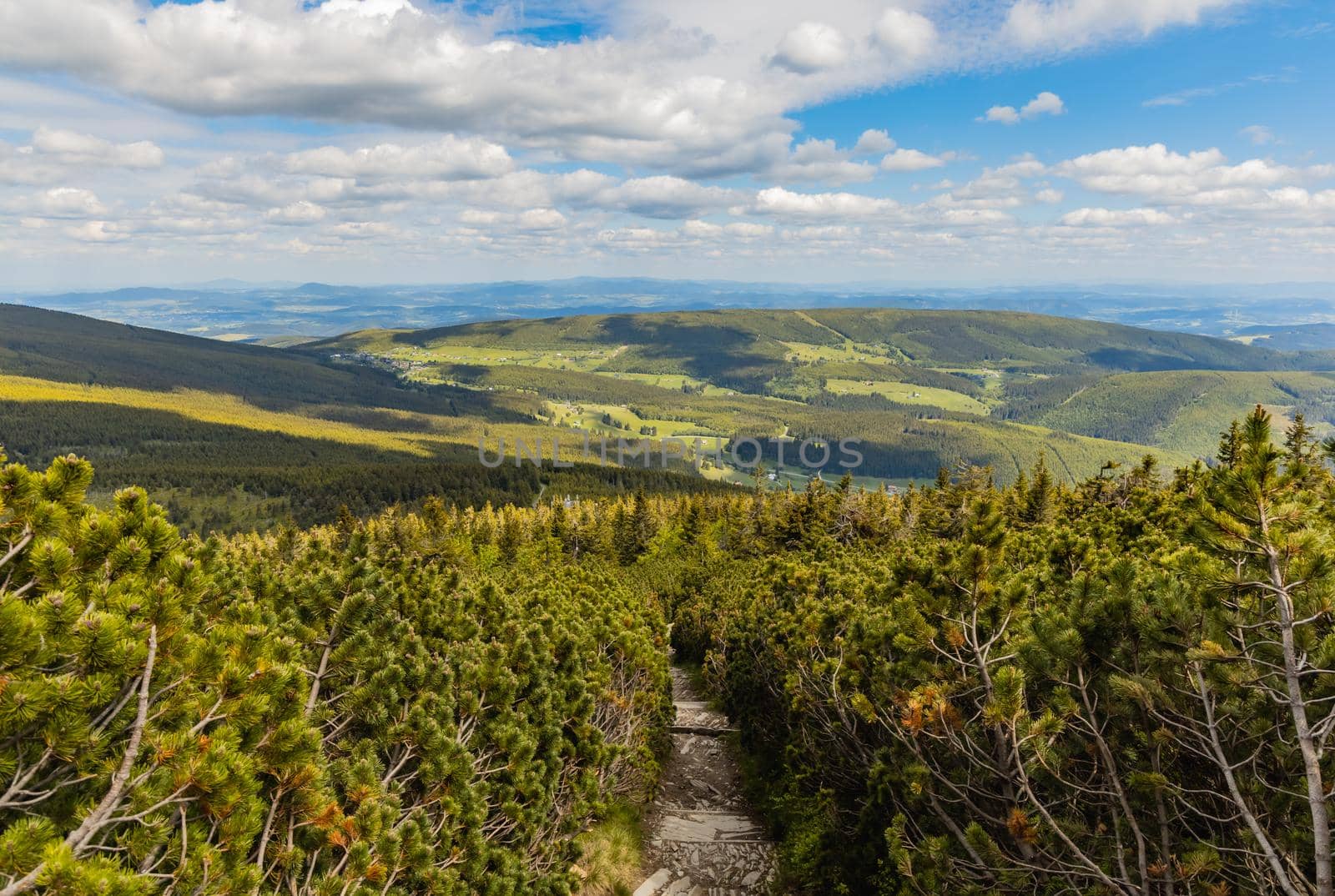 Long mountain trail full of stony stairs with panorama if Karkonosze Giant Mountains around