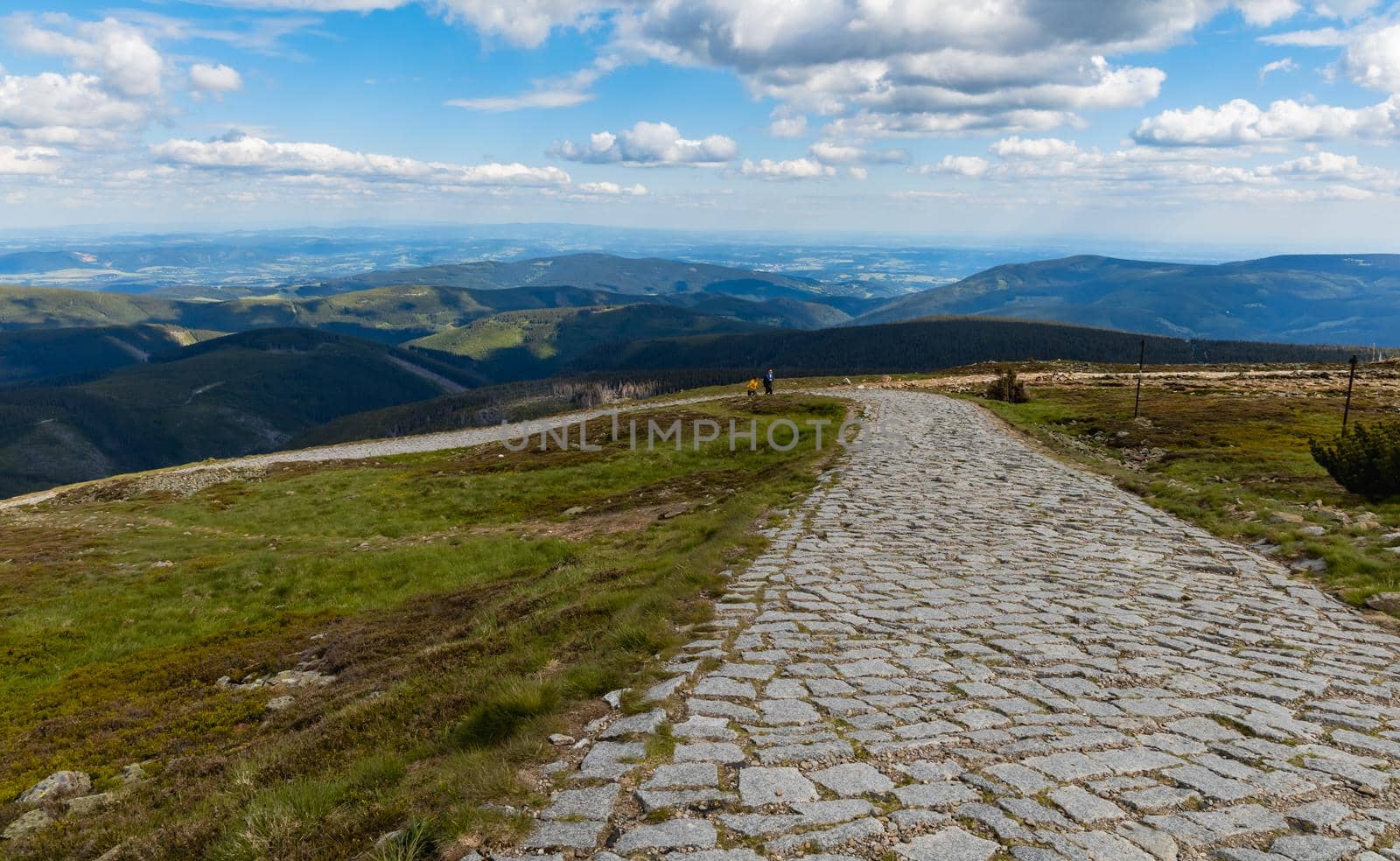 Long mountain trail with panorama of Karkonosze Giant Mountains around