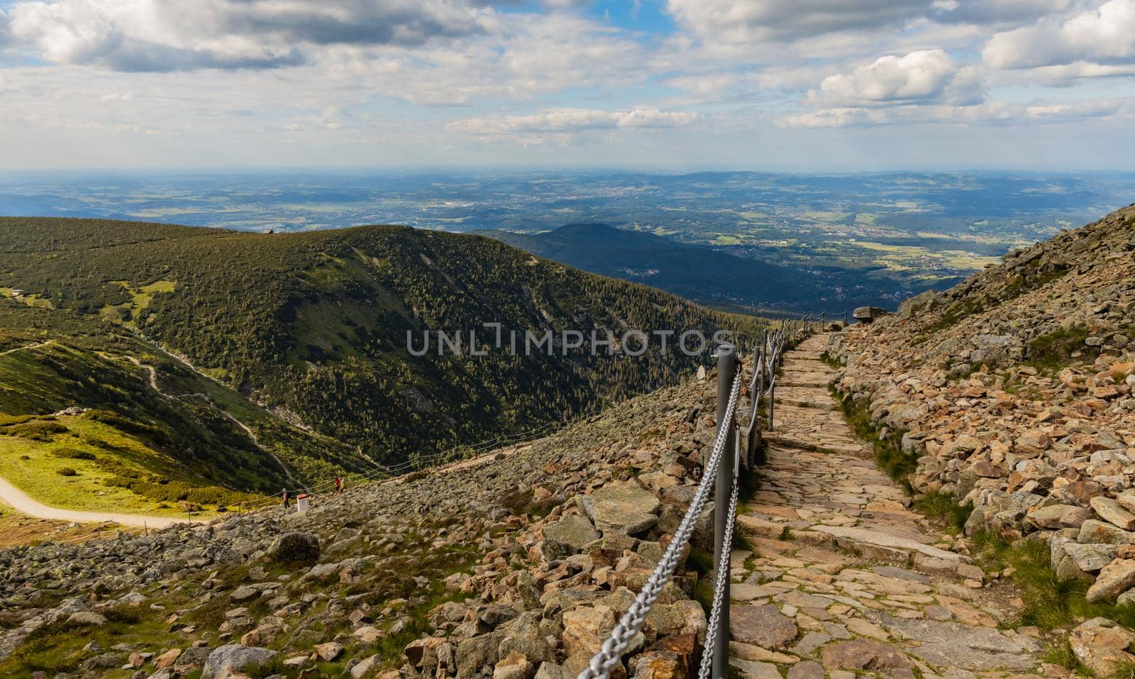 Long mountain trail with panorama of Karkonosze Giant Mountains around