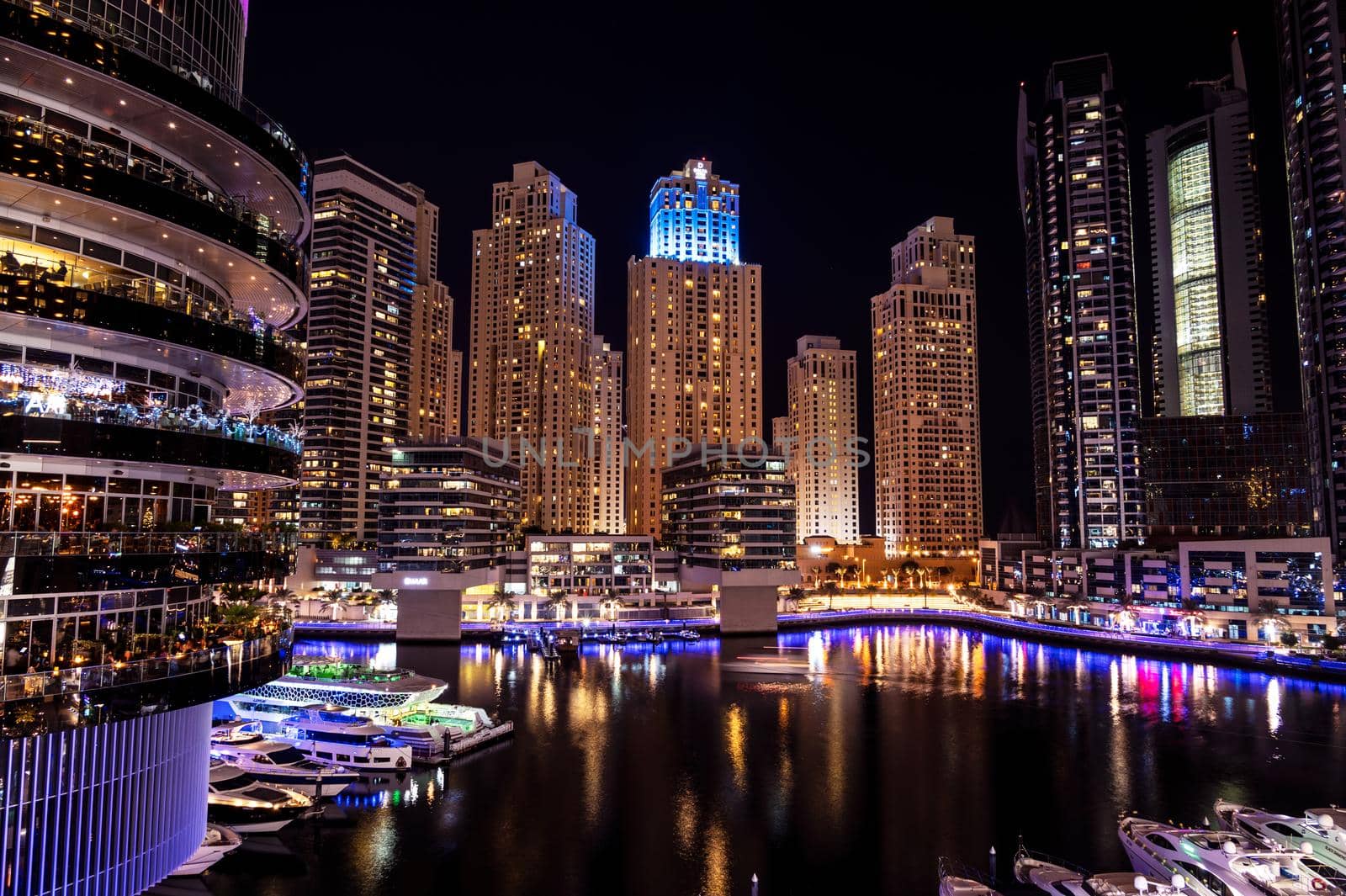 Dec 28, 2020 ,Dubai,UAE.Panoramic view of the beautifully illuminated sky scrappers, apartments and hotels captured from the marina mall ,Dubai, UAE. by sriyapixels