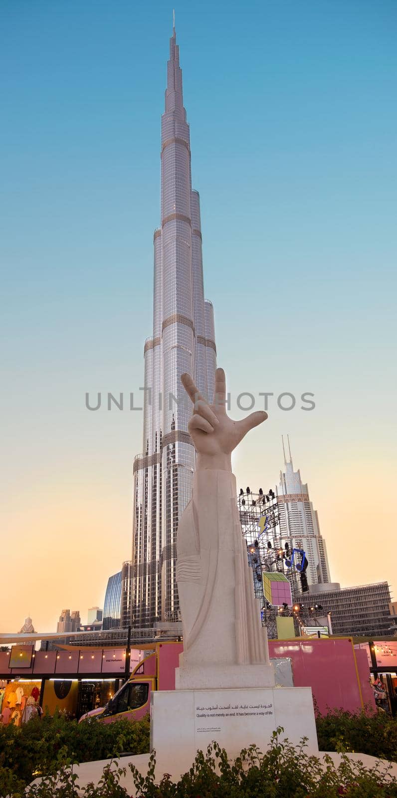JAN 7th 2021, DUBAI, UAE. Statue of a hand showing victory symbol with the Burj Khalifa at the background captured at the recreational etisalat dsf market , the burj park, Dubai,Uae. by sriyapixels