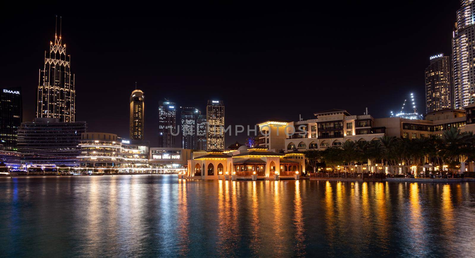 7th JAN 2021,Dubai,UAE . Beautiful view of the illuminated souk al bahar ,the dubai mall, hotels and other buildings captured at the recreational boulevard area of the Burj park , Dubai,UAE.