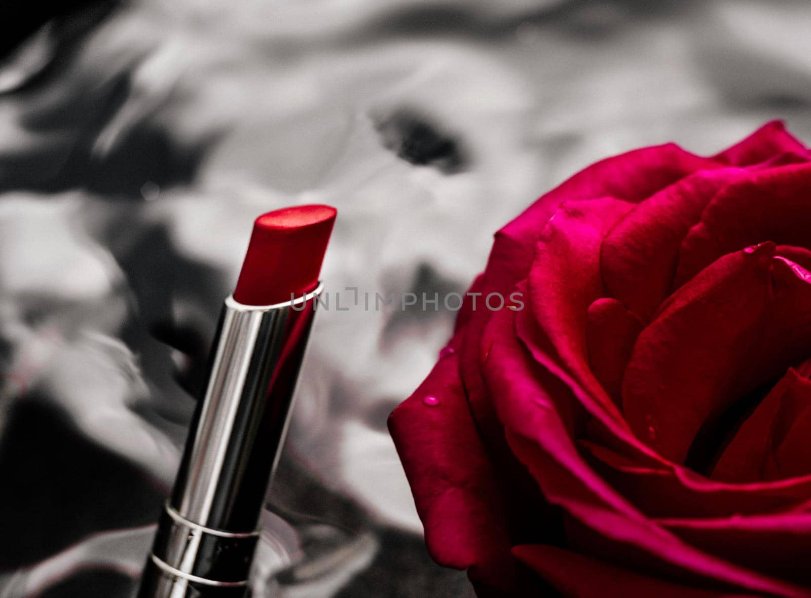 luxe red lipstick and a wonderful rose - make-up and cosmetics styled beauty concept by Anneleven