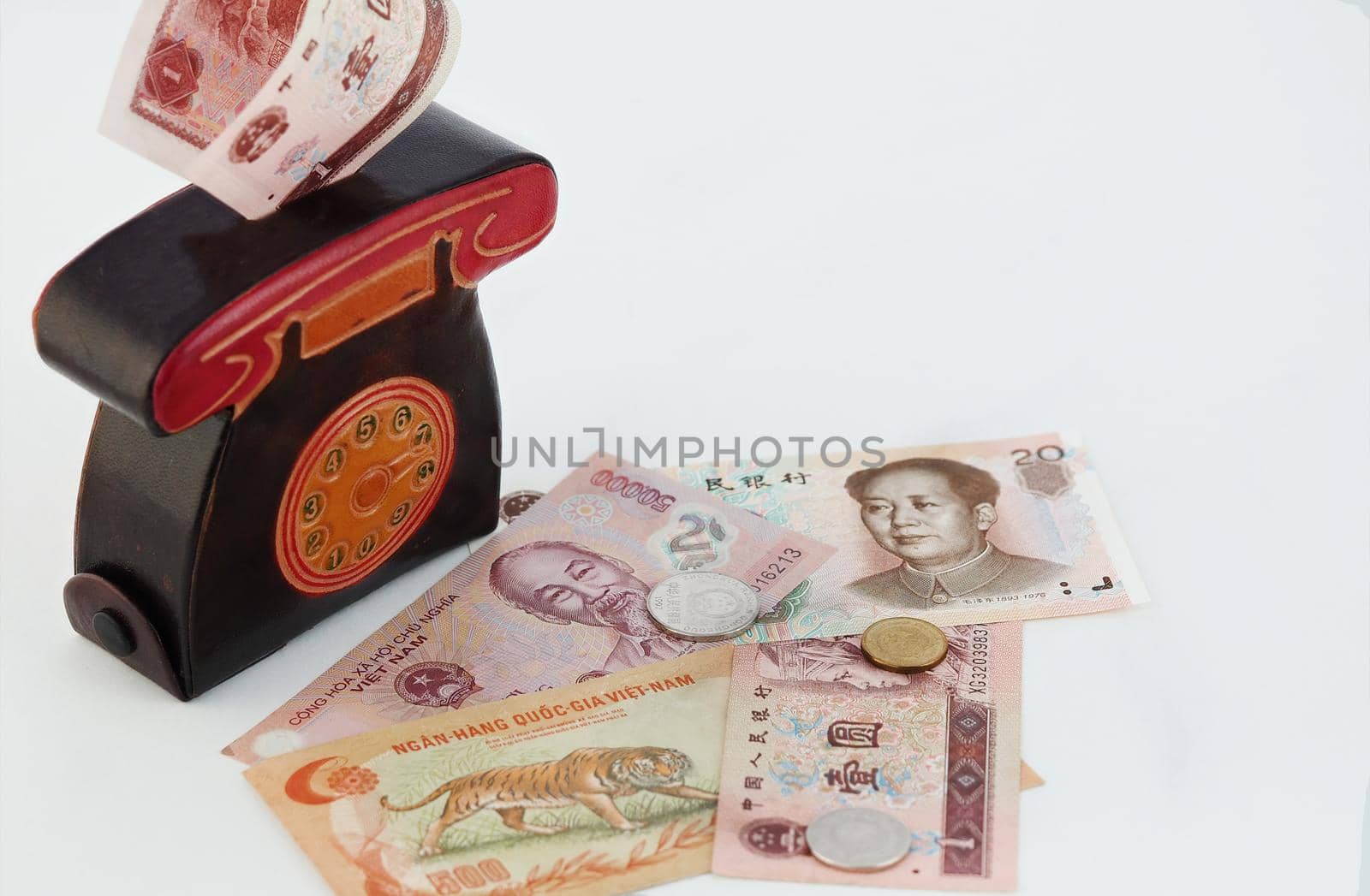 A cash piggy bank or purse with paper banknotes, Vietnamese money, isolated on a white background with a place for inscription. by Olga26