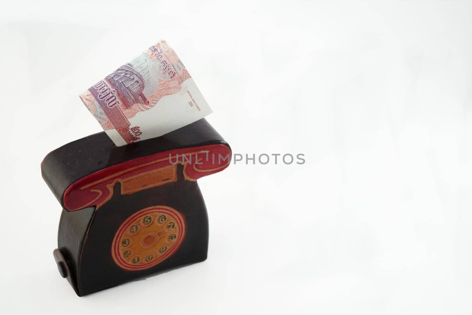 Piggy for money or wallet with paper bills. Cambodia isolated on a white background with a place to sign by Olga26