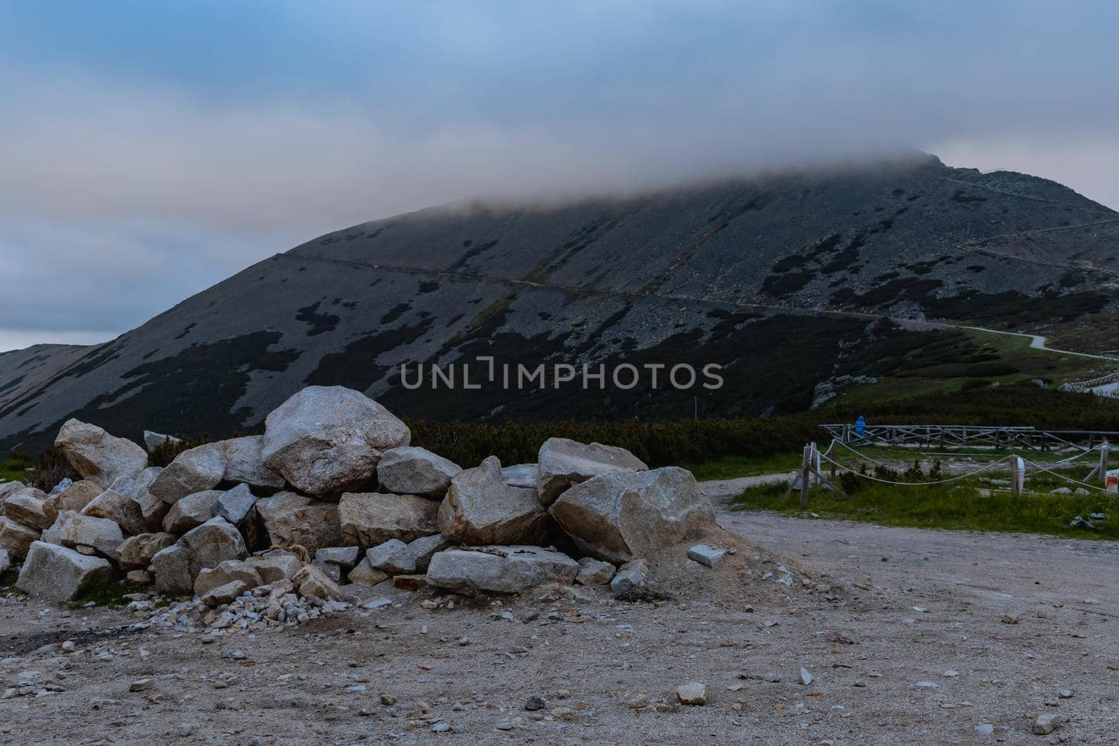 Pile of stones next to mountain trail to Sniezka mountain in Giant Mountains