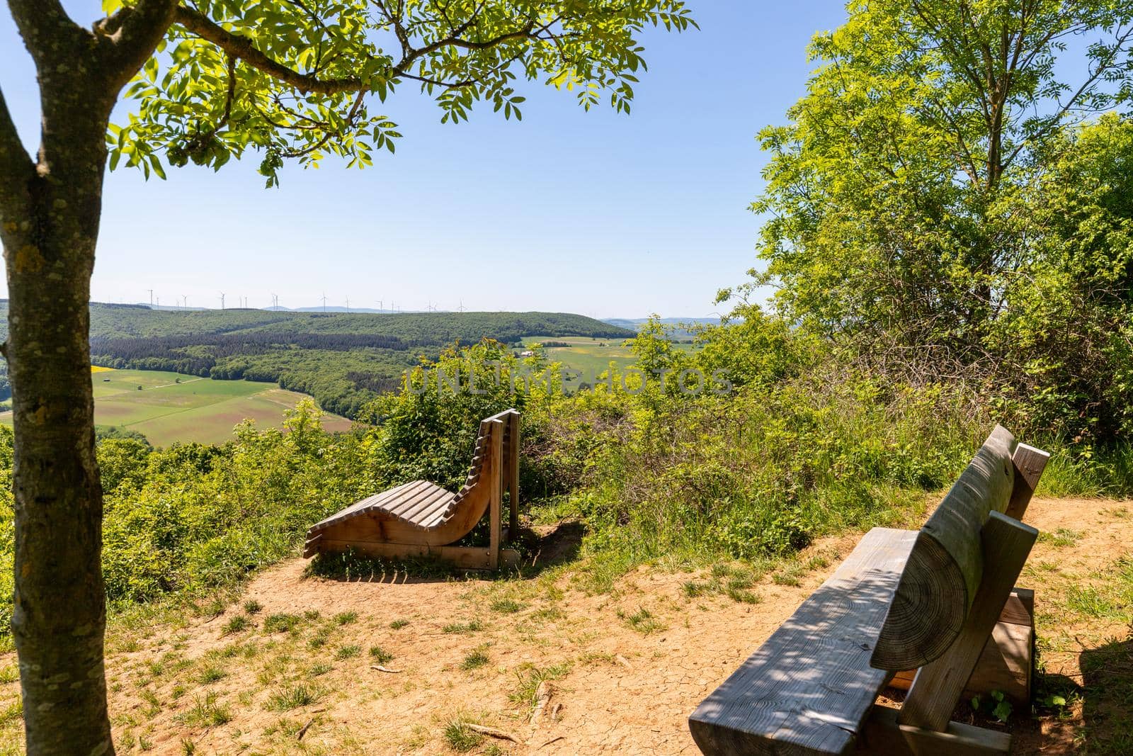 Scenic view from the Lemberg at landscape with  wooden bench in the foreground