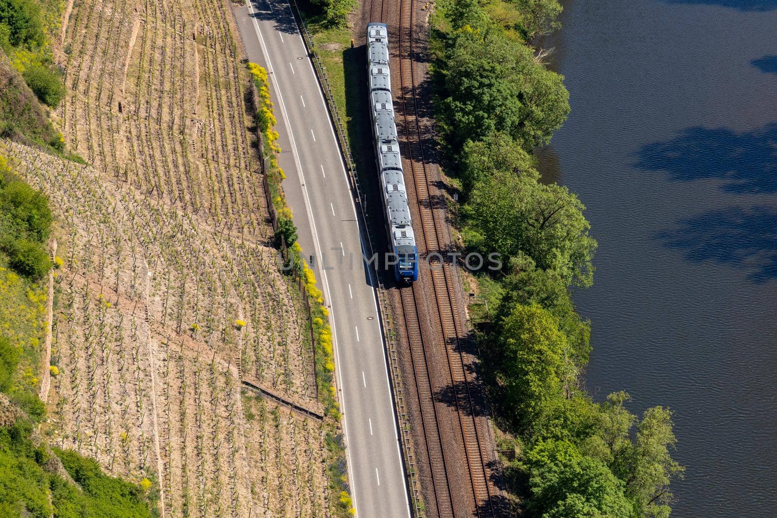 High angle view from the Rotenfels of Nahe river and railway line with passenger train