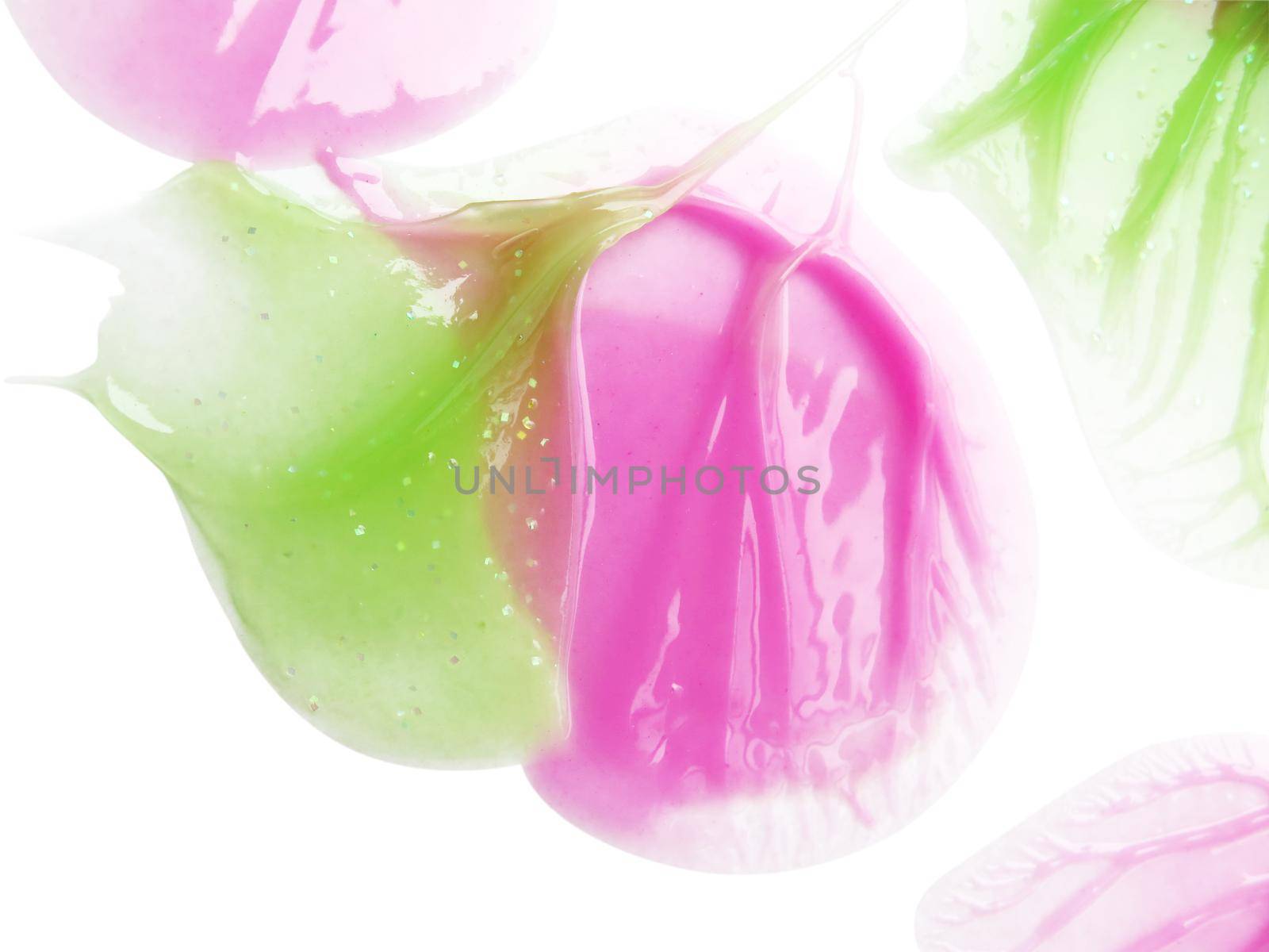 Pink and green Lipgloss spread sample on white background by aroas