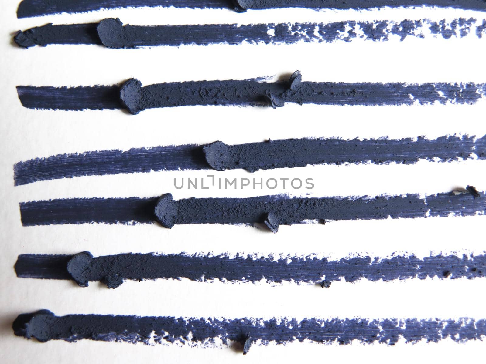 close up of a eyeliner pencil drawing on white background