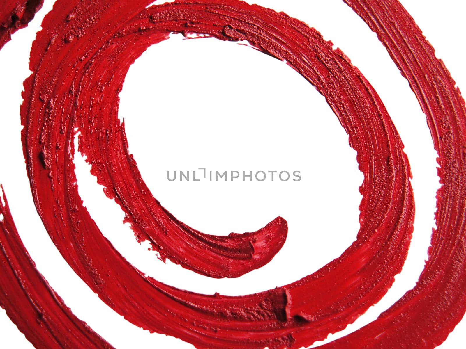 close up of a smudged spiral RED lipstick on white background