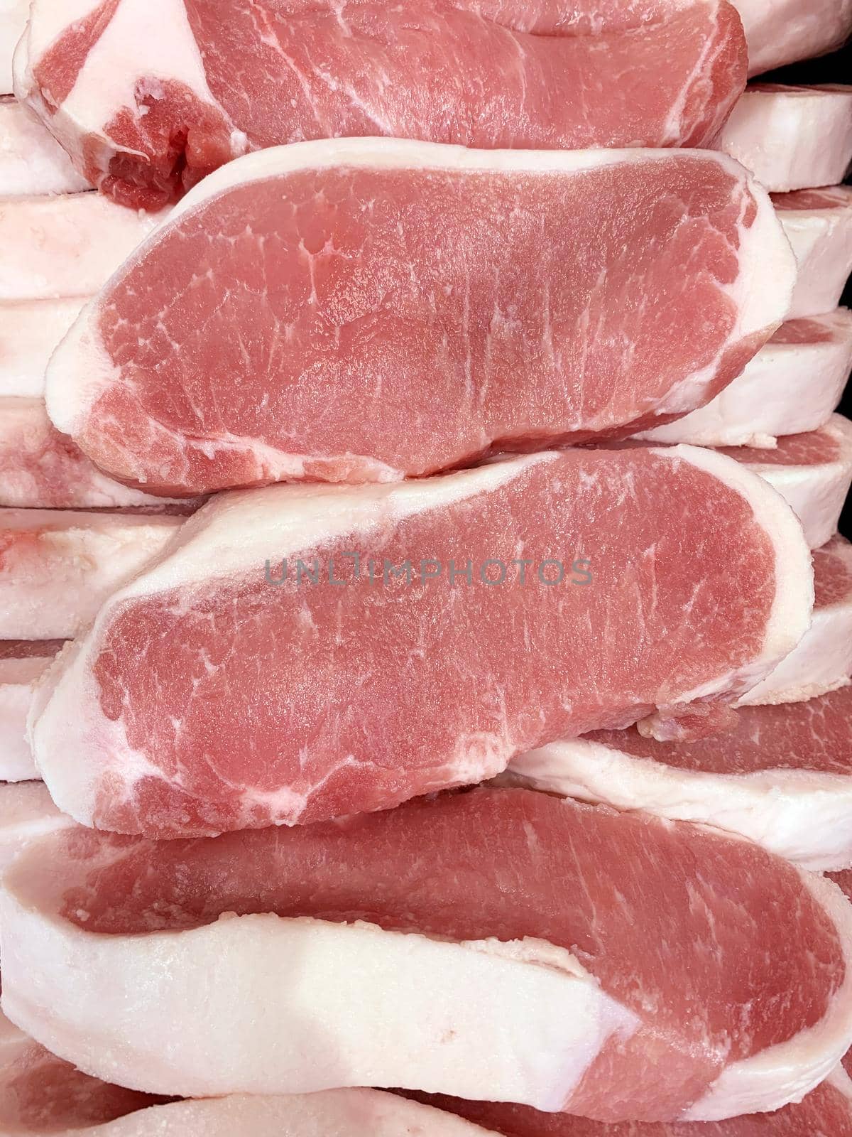 Pork raw meat slices in a butcher shop by aroas