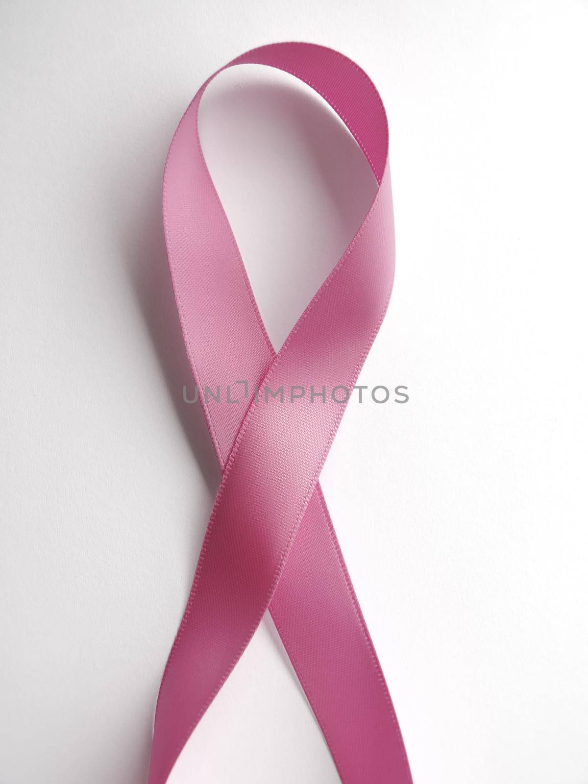 Pink ribbon against cancer isolated on white background. Clipping Path included